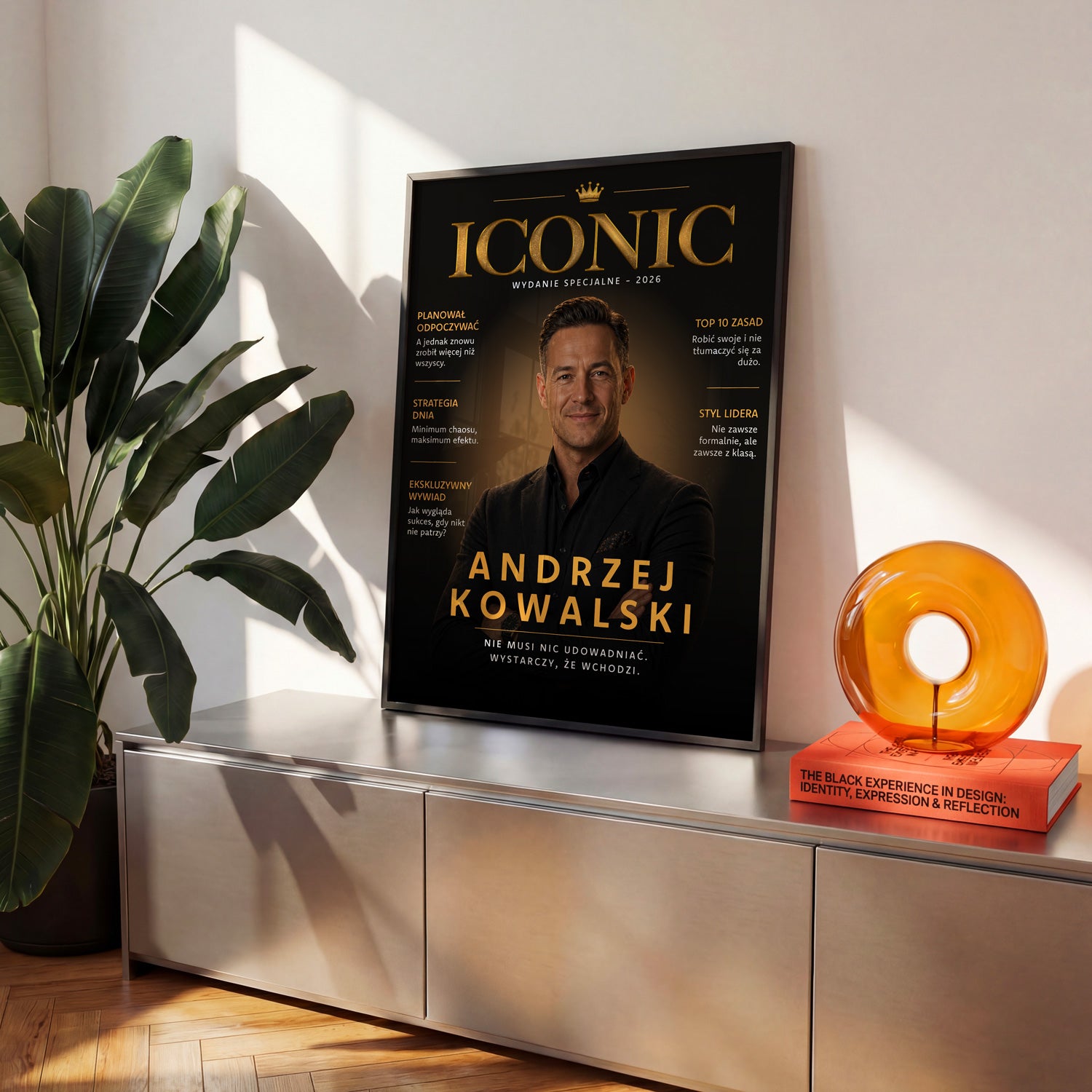 Plakat magazynowy Iconic w czarnej ramce na metalowej komodzie w jasnym salonie