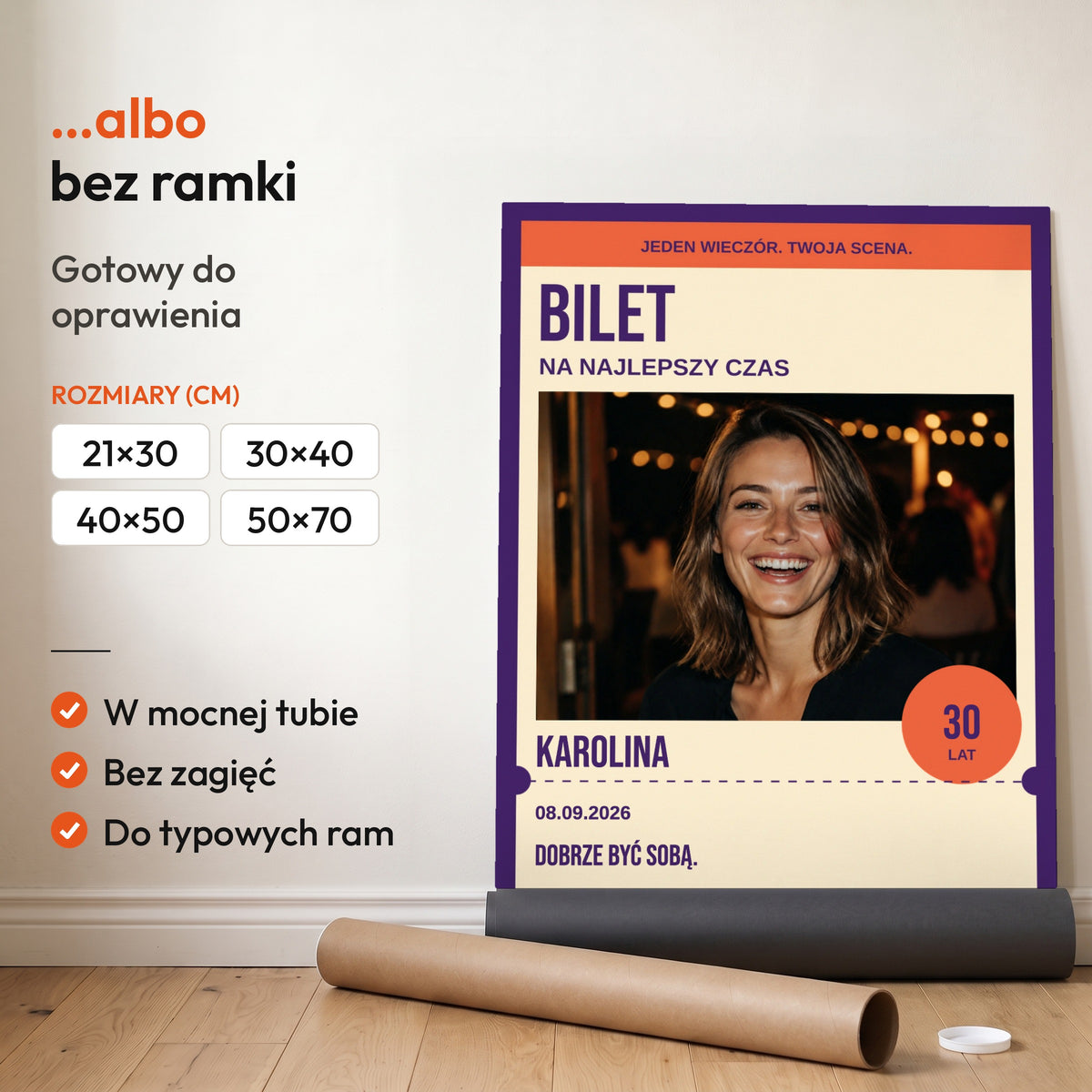BILET — plakat bez ramki, gotowy do oprawienia: rozwinięty z rolki, obok tuba do wysyłki. C-PL-URODZ-30-3-2130-NF