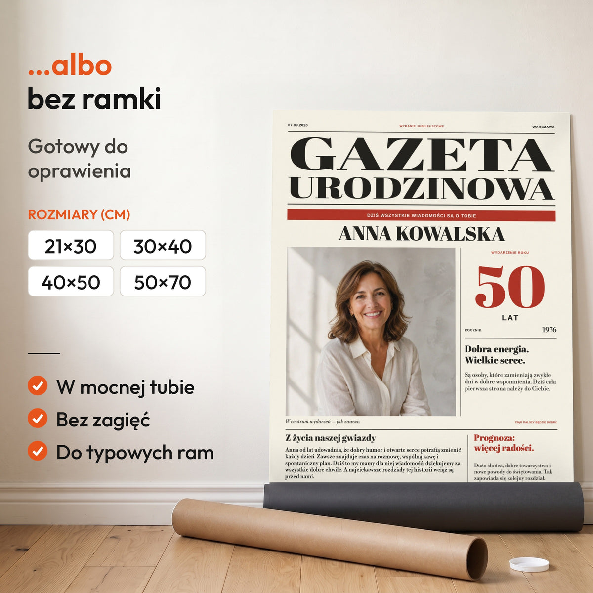 Gazeta Urodzinowa — plakat bez ramki, gotowy do oprawienia: rozwinięty z rolki, obok tuba do wysyłki. C-PL-GAZ-7-2130-NF
